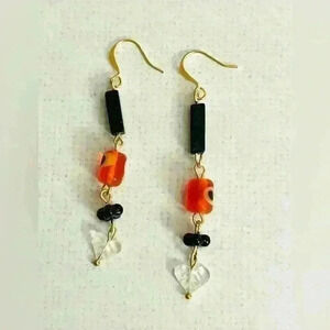 Handmade orange evil eye glass bead dangle earrings with carved quartz hearts